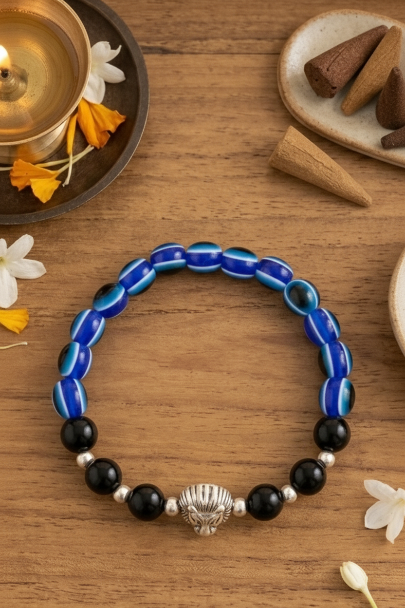 Bracelets with lion head charm on wooden surface with SVASTI branding