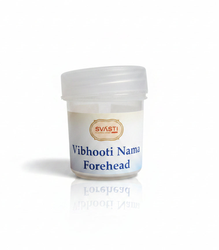 Small container labeled 'Vibhooti Nama Forehead' by 'Svasti' on a reflective surface.