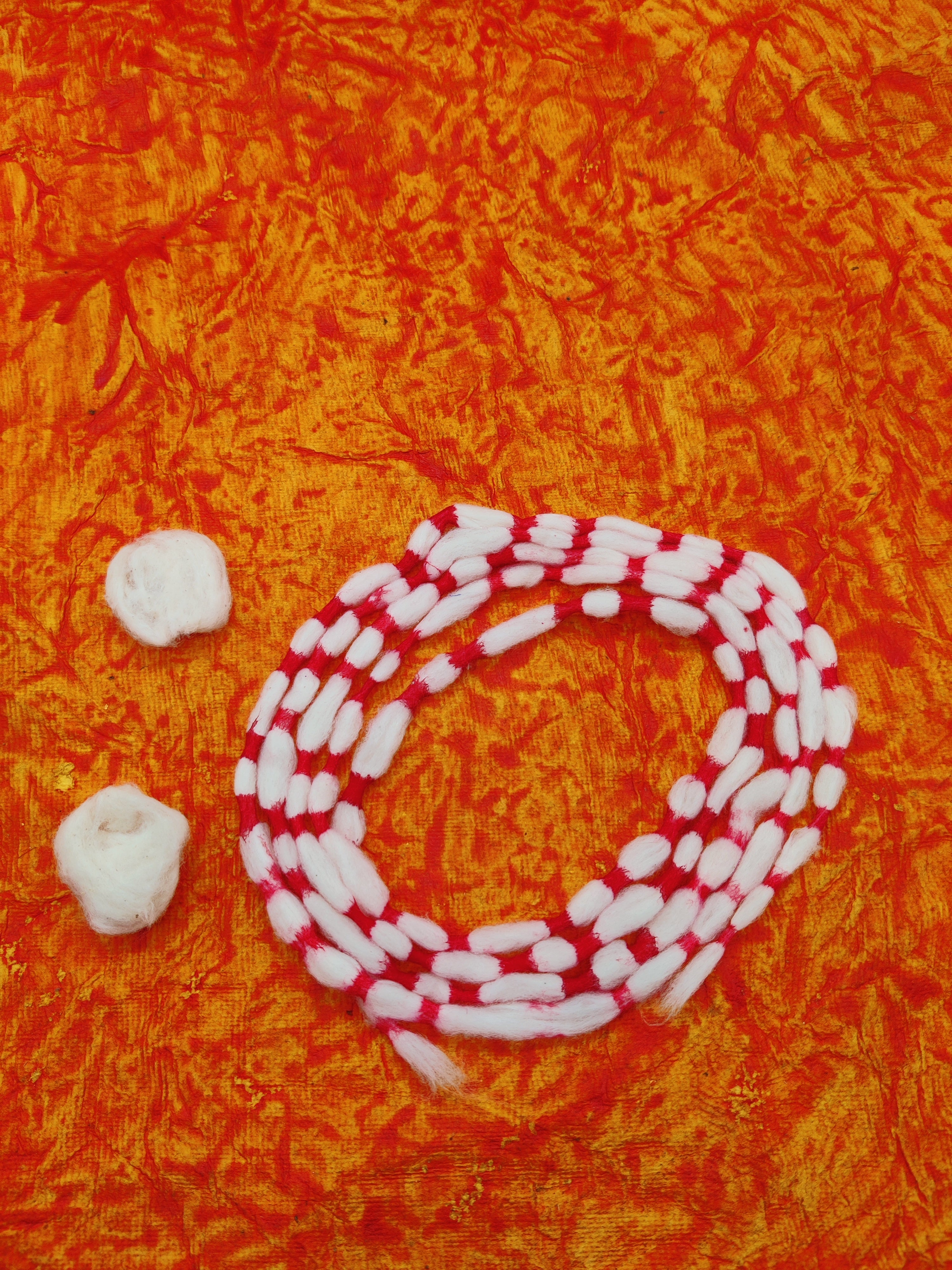 Red and white striped rope on an orange textured background