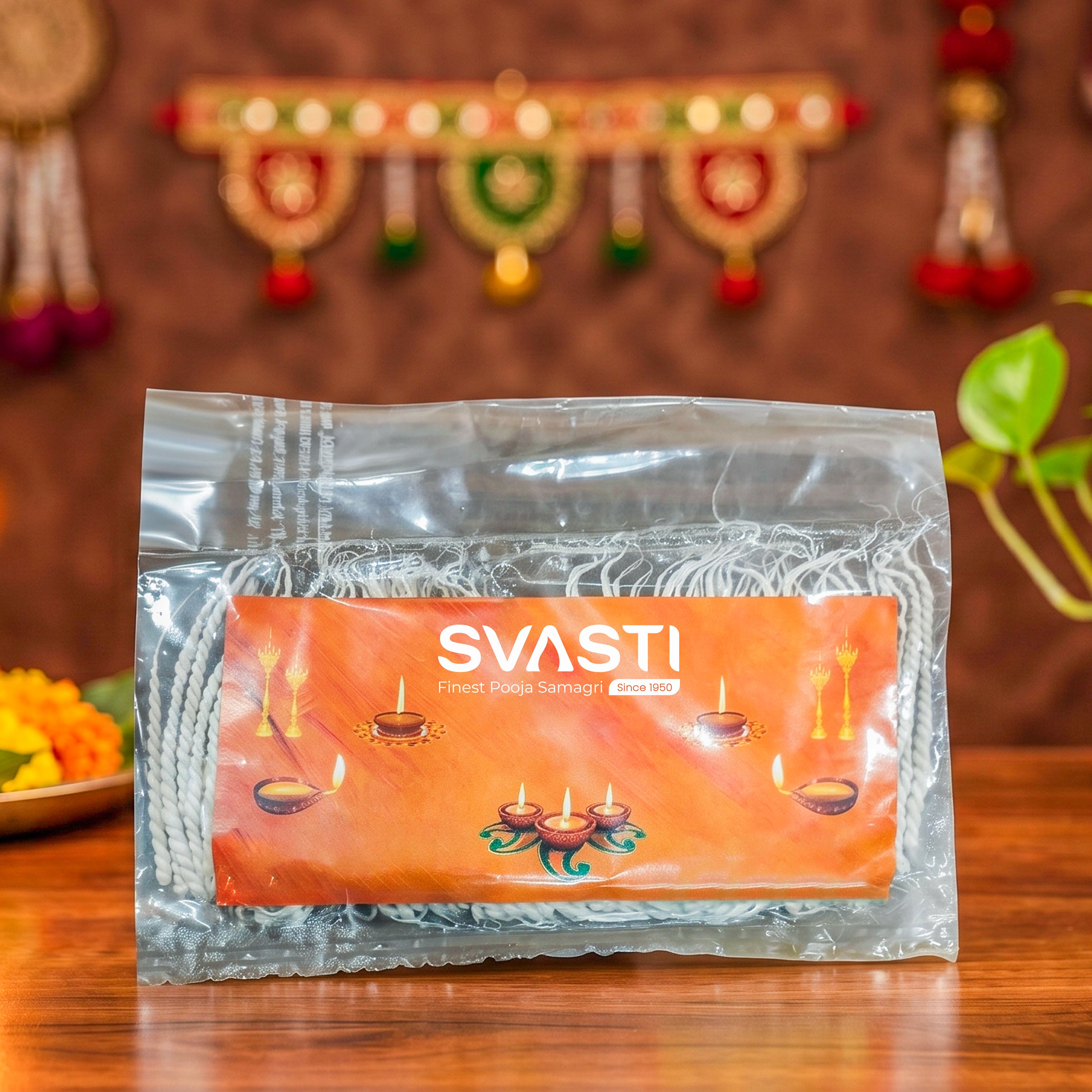 Packaged product with 'SVASTI' branding on a wooden surface with decorative items in the background