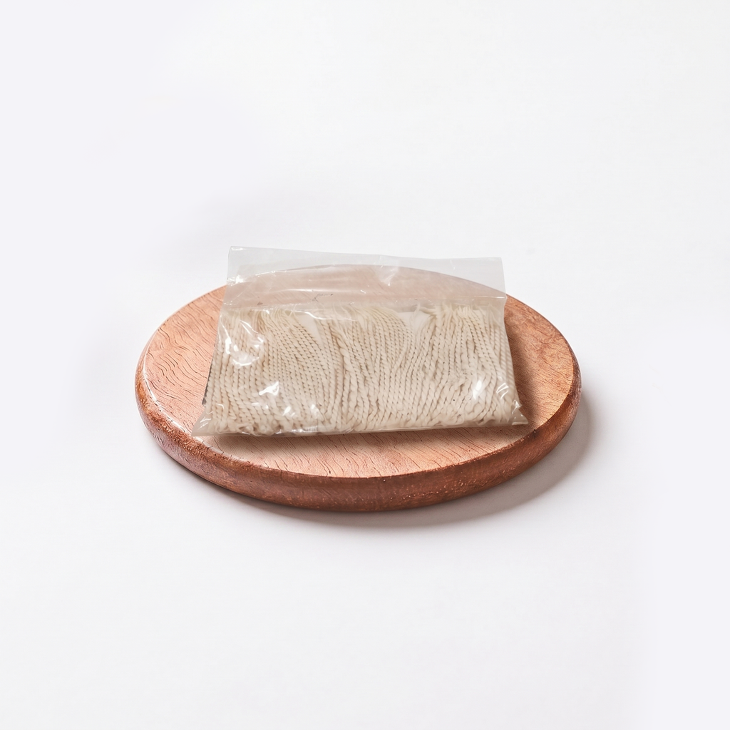 Packaged food item on a wooden plate with a white background