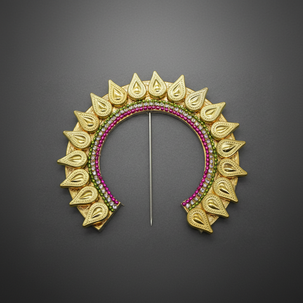 A gold crescent-shaped brooch with leaf-like cutouts and rows of pink and green stones, displayed on a dark gray background.