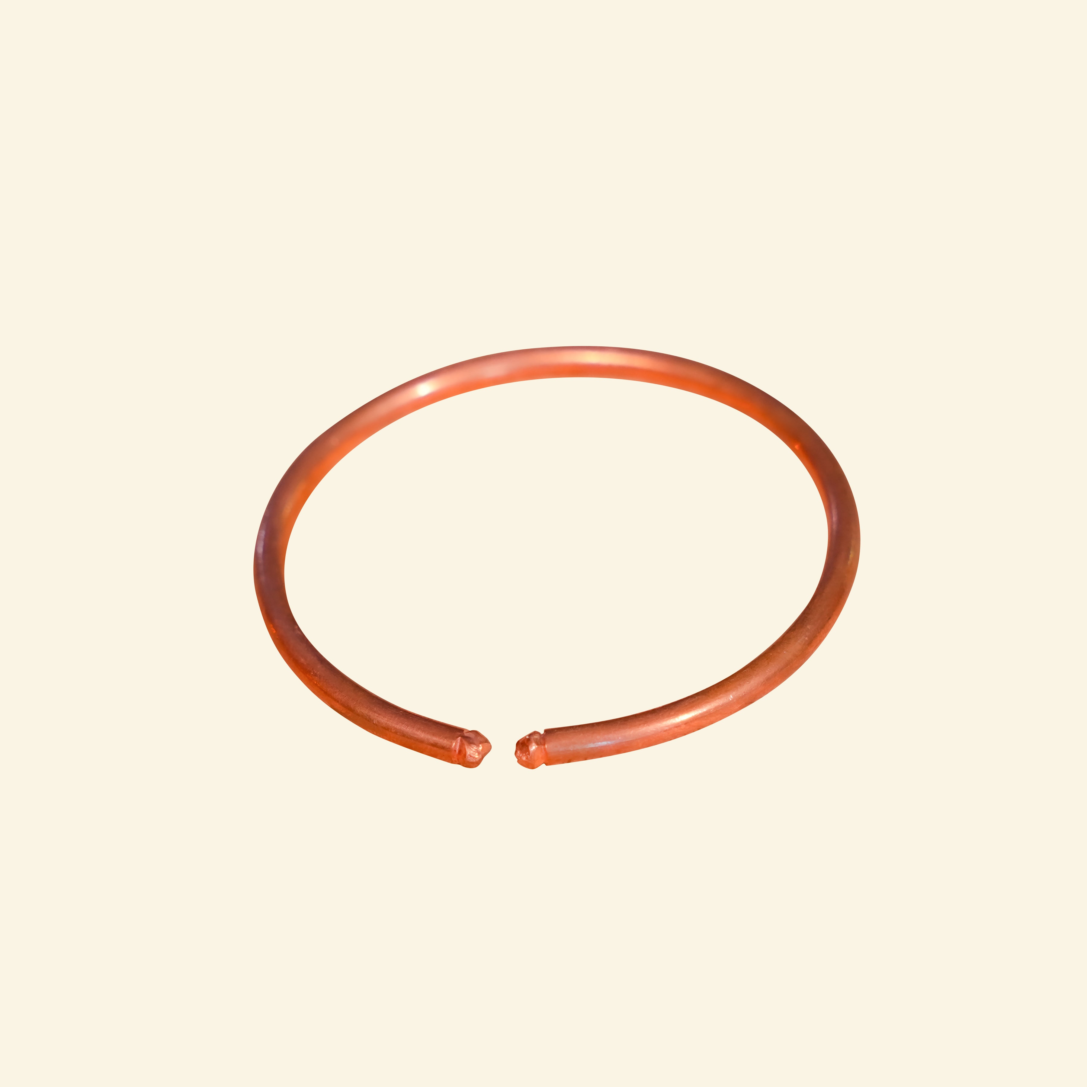 Orange bangle on a beige background
