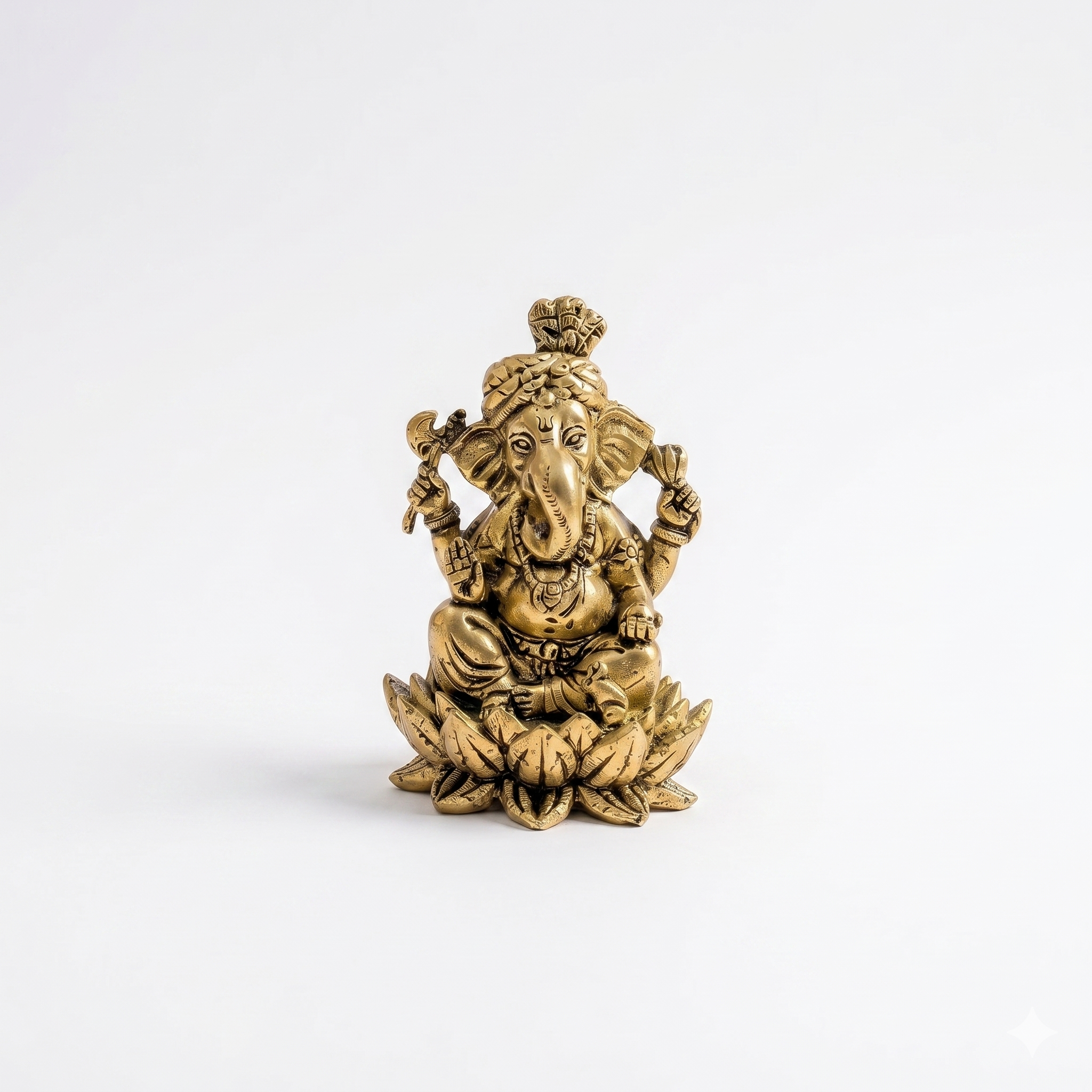 Gold-colored statue of a deity on a white background