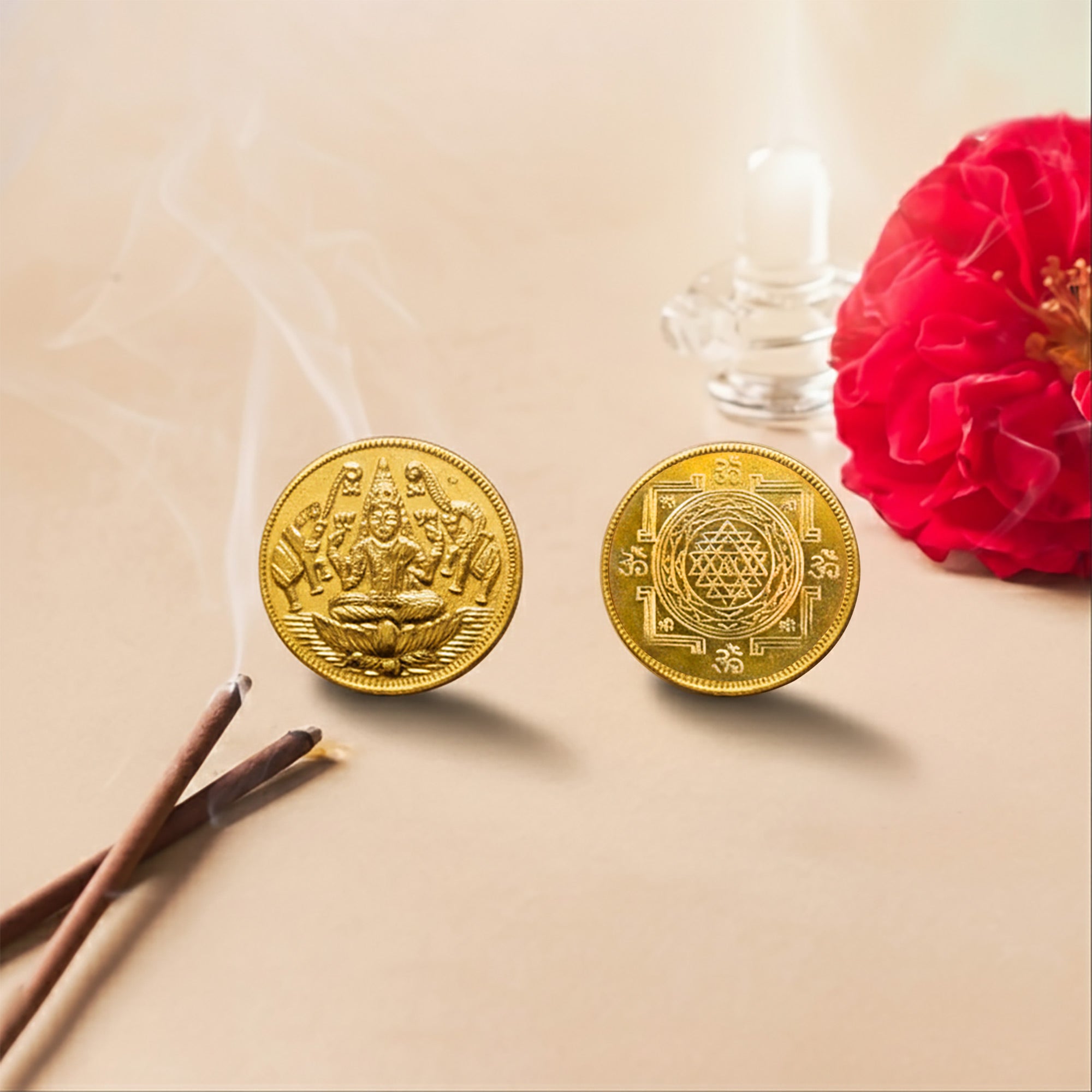 Front face of the round antique golden Lakshmi coin showing the detailed relief carving of Gaja Lakshmi seated on a lotus.