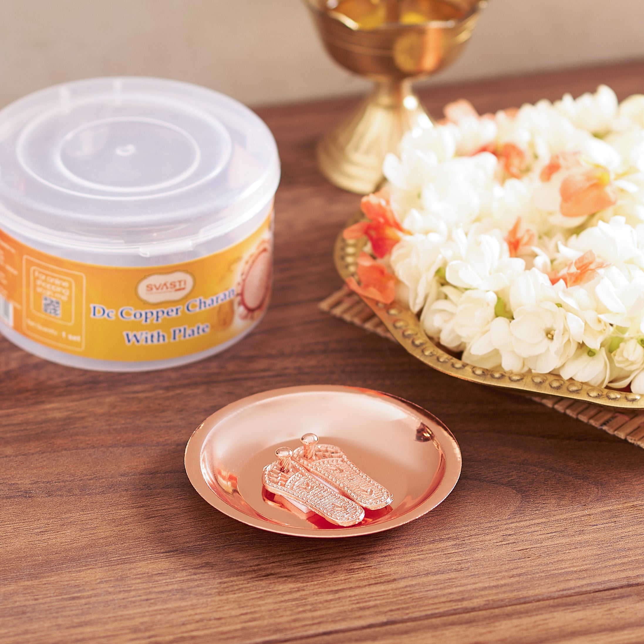 Copper chawal with a container labeled 'Puran Copper Chawal' on a wooden surface.
