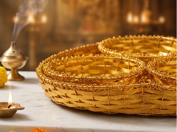 Collage of a woven golden basket on a marble surface with decorative elements.