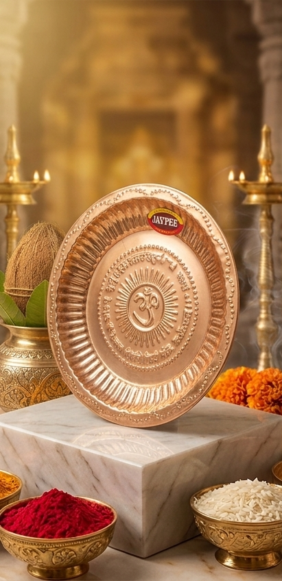 Copper plates with decorative elements on a marble surface