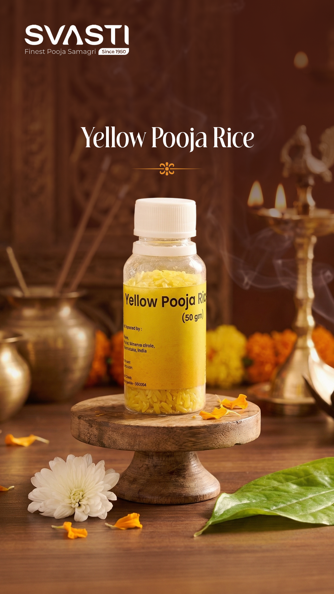 Premium yellow ritual rice displayed on a wooden surface backdrop, flanked by a tall polished brass stand lamp and a lit lotus-shaped tea light holder.