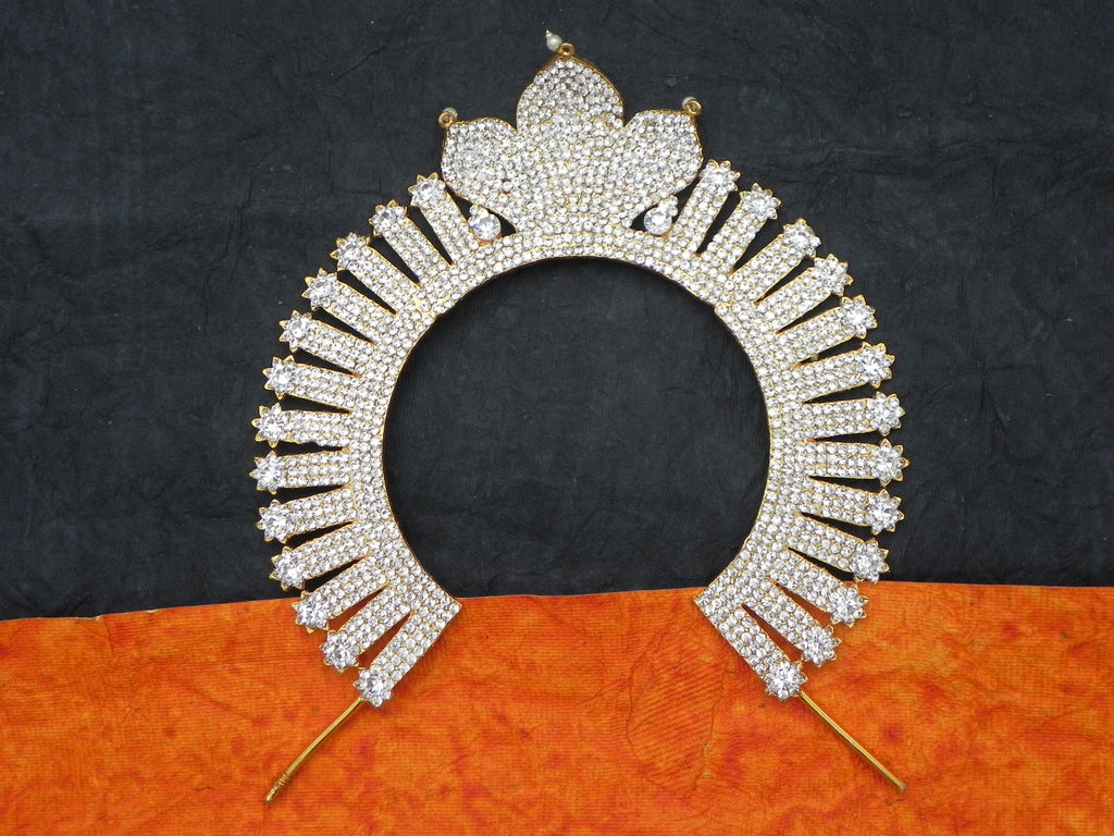 A decorative stone arch with a metallic back and multicolored stones, designed to be used as an adornment for a deity statue.